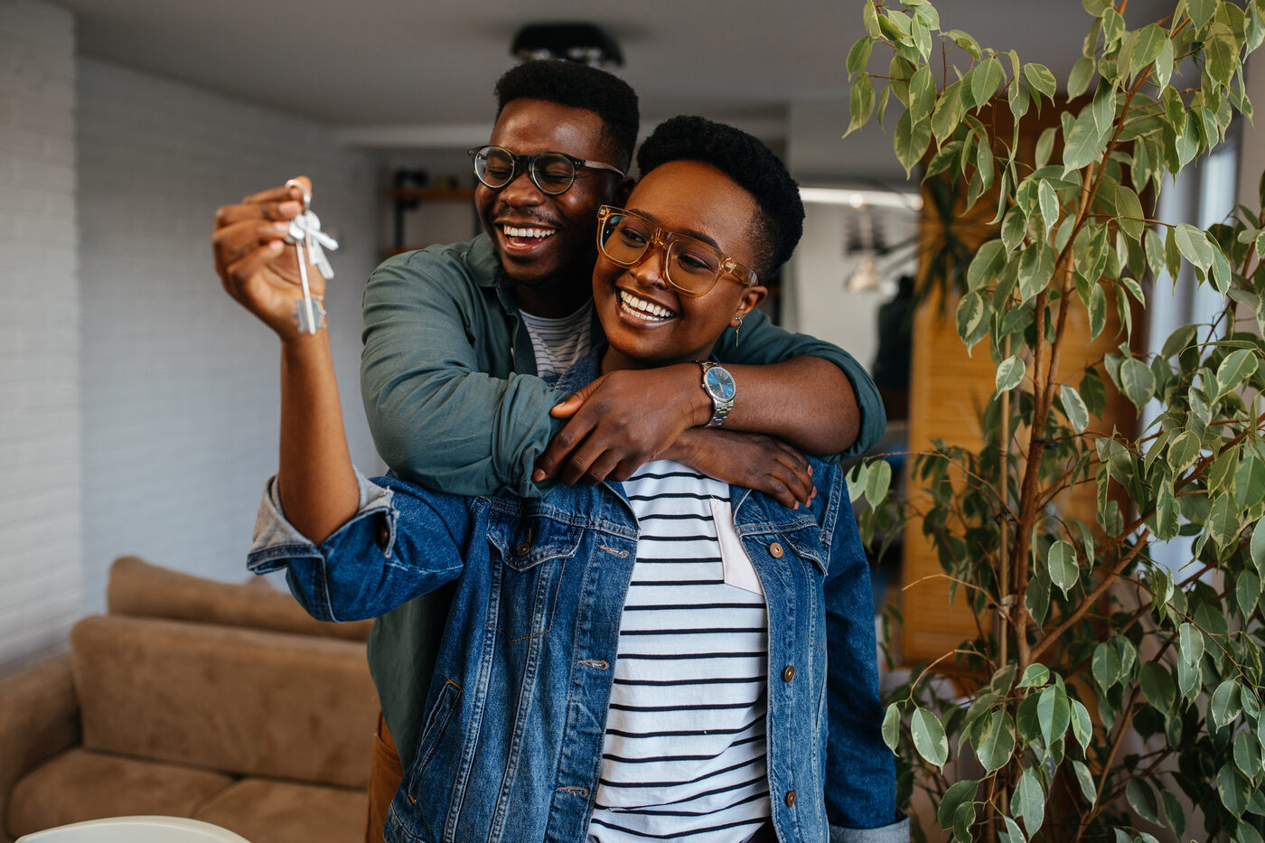 Jamaican couple celebrating with the keys to their new home